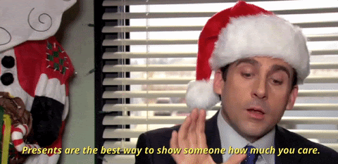 the-office-gif-man-in-santa-hat-saying-presents-are-the-best-way-to-show-someone-how-much-you-care